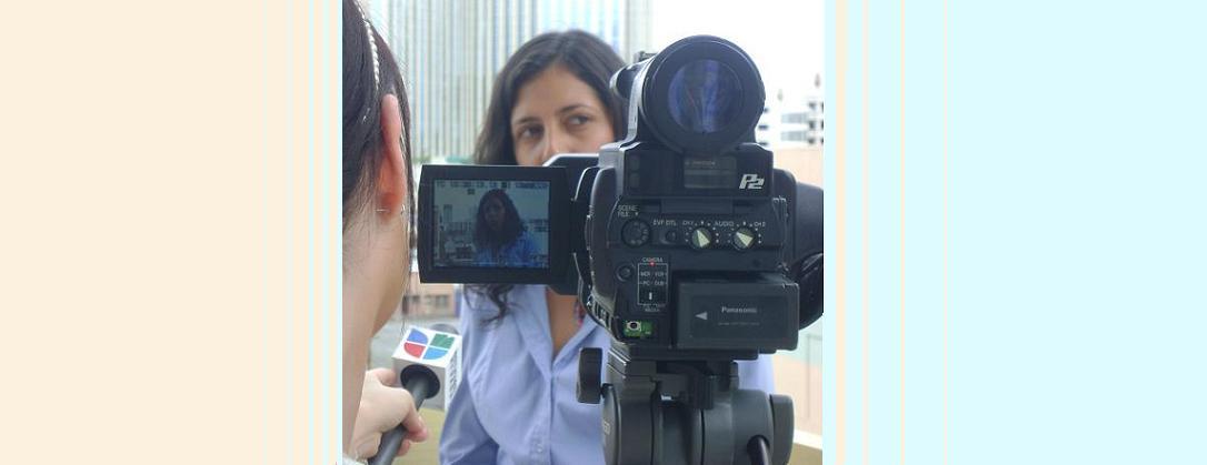 Julieta Corazon is shown being interviewed by a Univision reporter.